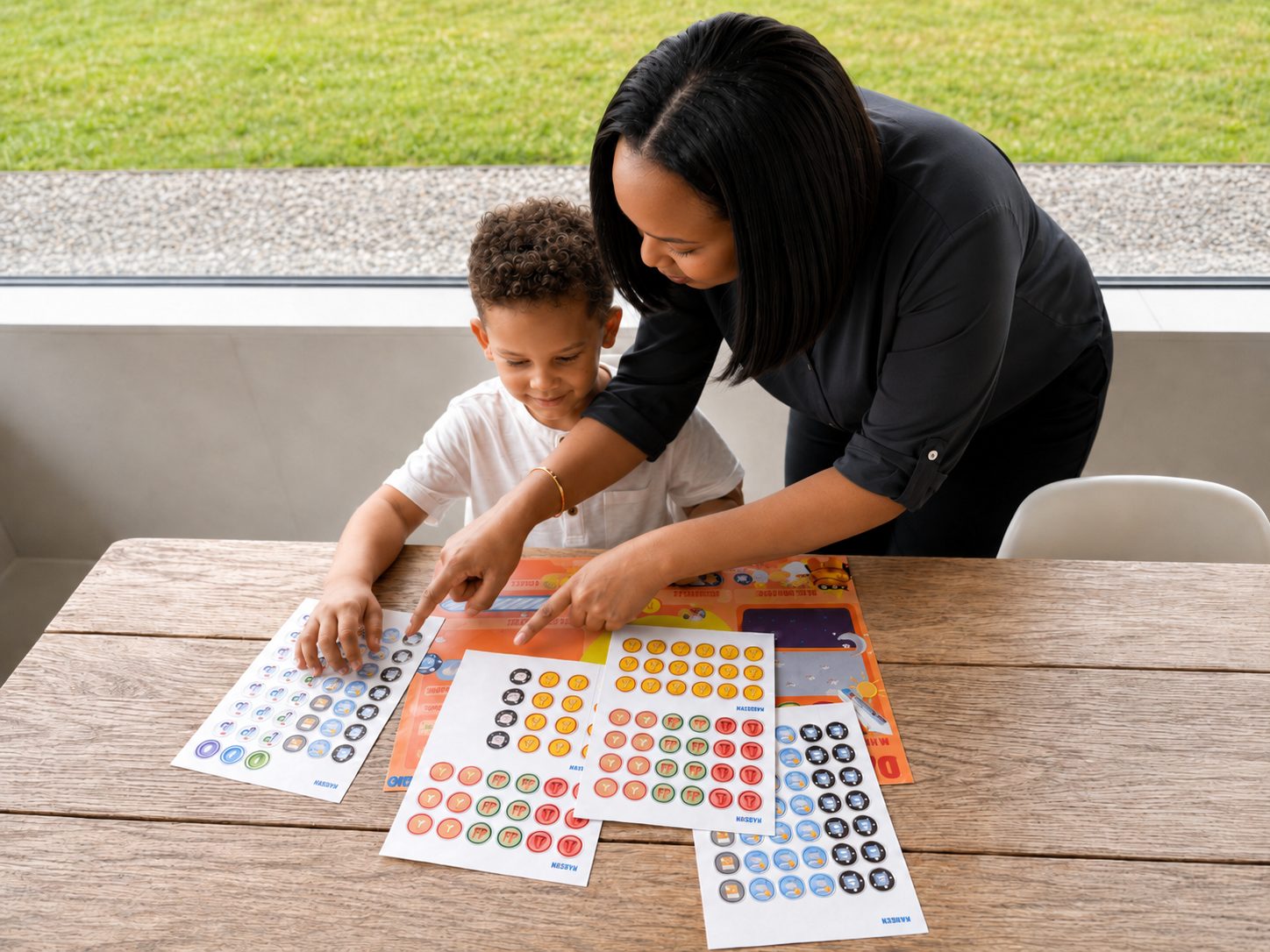 Parent and child choosing stickers for the log card