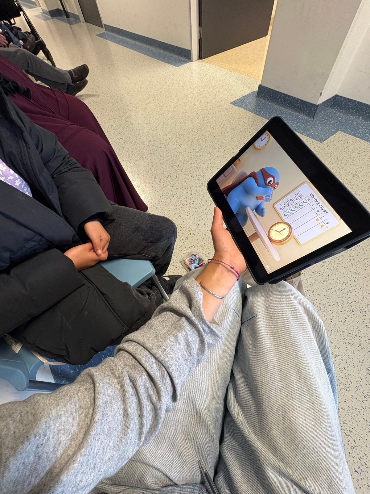 Testing a hero video on a tablet with a child in a hospital waiting room