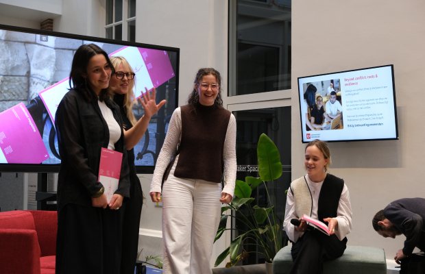 The team presenting the magazine on stage