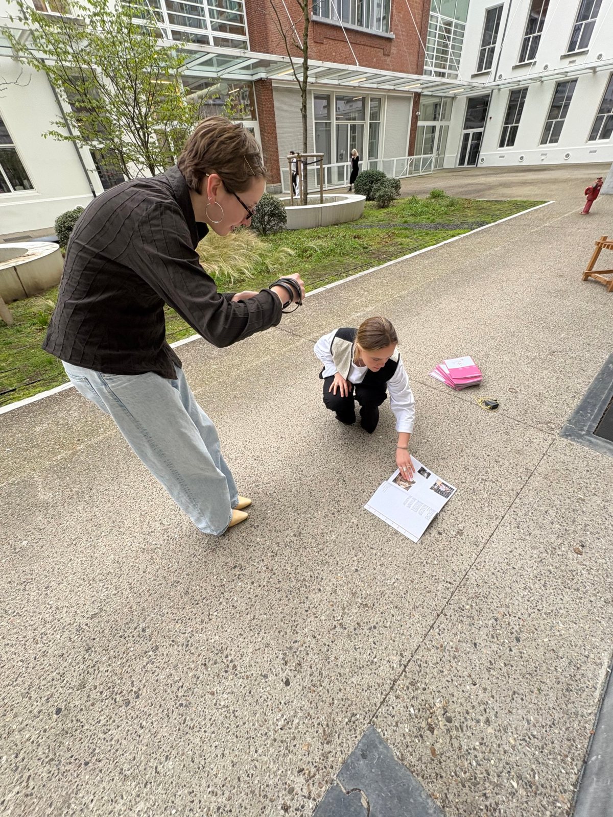 Photographing magazine pages outside on the campus